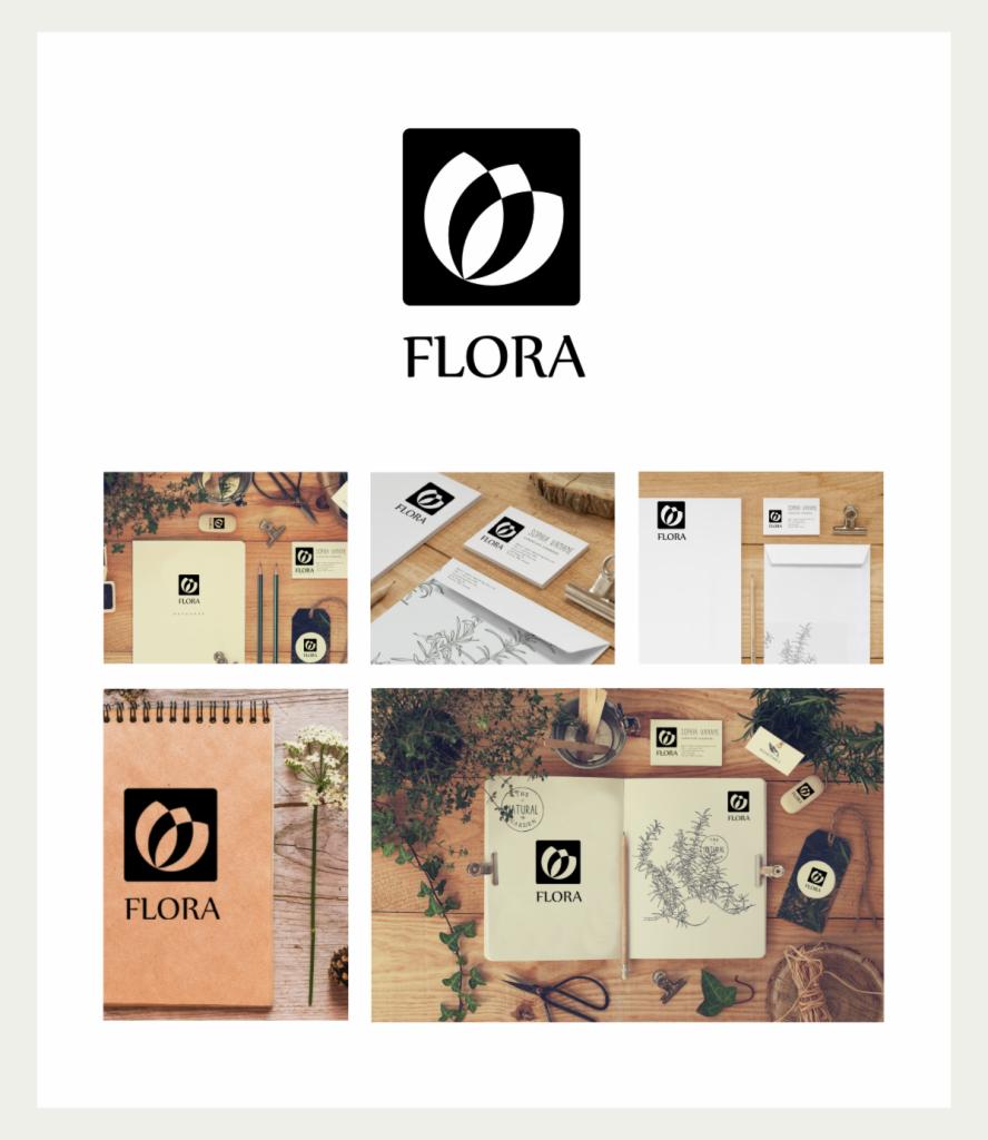 Prezentacja identyfikacji wizualnej marki Flora: logo, wizytówki, papier firmowy, notatniki, zawieszki, wszystko w estetyce naturalnej z elementami roślinnymi.
