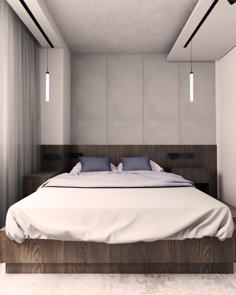 Minimalistyczna sypialnia z drewnianym łóżkiem, betonowymi panelami ściennymi i wiszącymi lampami tubowymi.