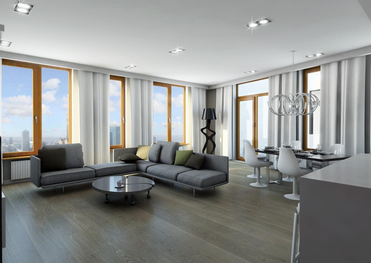 Nowoczesny salon z szarym narożnikiem, okrągłym stolikiem kawowym, drewnianą podłogą i dużymi oknami z widokiem na miasto w tle, oświetlony lampą podłogową o abstrakcyjnym kształcie i designerskim...