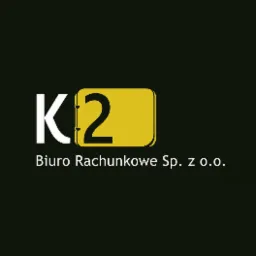 Logo firmy K2 Biuro Rachunkowe Sp. z o.o. na czarnym tle. Żółty prostokąt z zaokrąglonymi rogami otacza cyfrę 2 w kolorze czarnym.