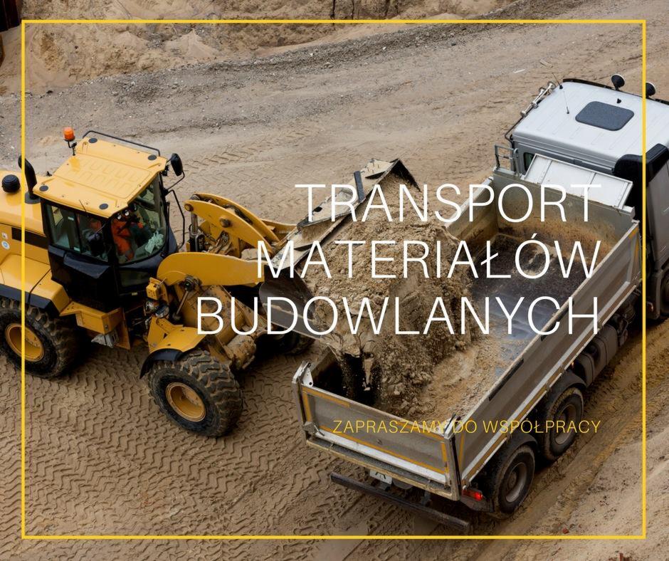 Żółta ładowarka czołowa i ciężarówka podczas transportu materiałów budowlanych w Grodzisku Mazowieckim.