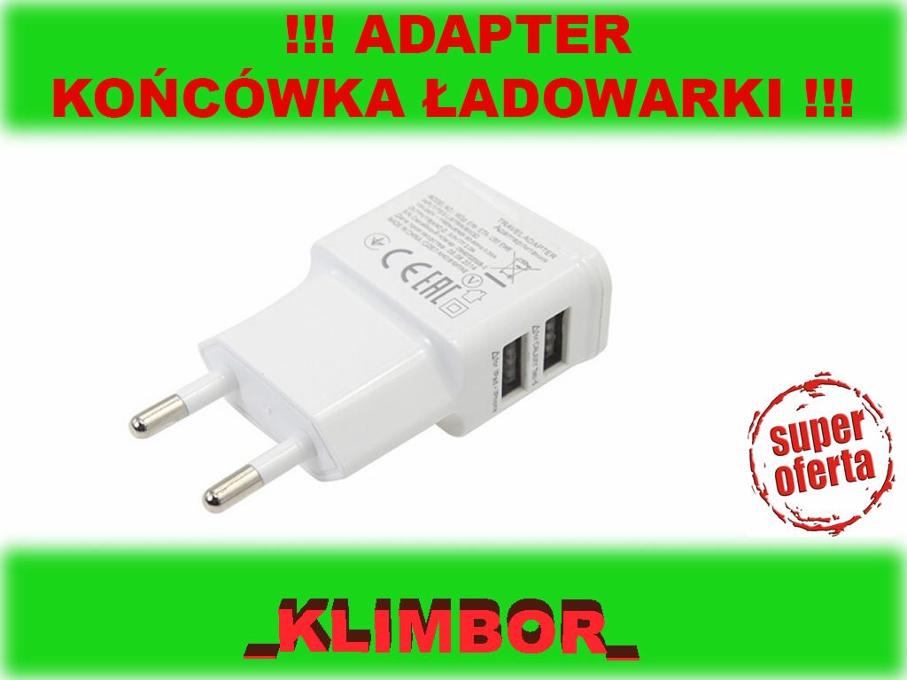 Biała ładowarka USB z dwoma portami USB na białym tle, z widocznymi oznaczeniami CE i symbolem recyklingu, otoczona tekstem reklamowym.