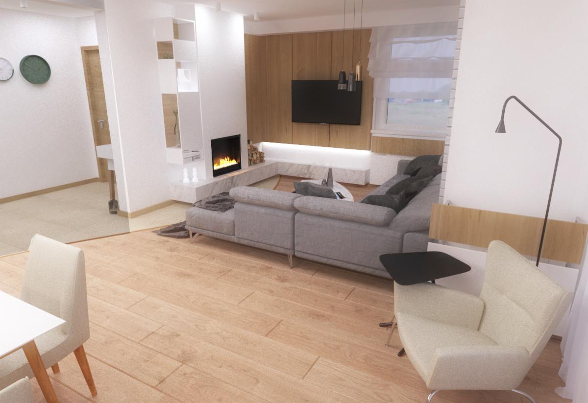 Jasne, przestronne wnętrze salonu z drewnianą podłogą, szarą sofą narożną, kominkiem obudowanym marmurem i telewizorem na drewnianej ścianie. W tle widoczne okno z roletami rzymskimi.