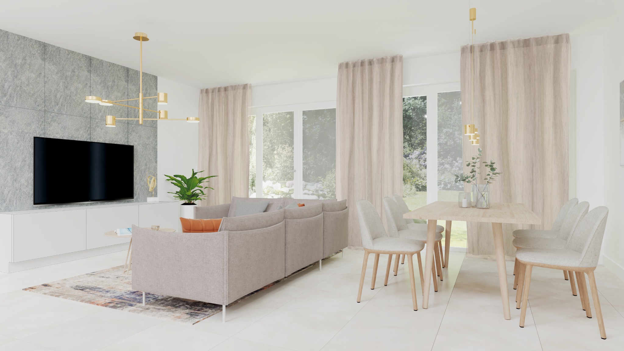 Jasny salon z kuchnią: szara sofa z pomarańczową poduszką, stół z czterema krzesłami, telewizor na tle ściany z szarego kamienia, złoty żyrandol, duże okna z beżowymi zasłonami.