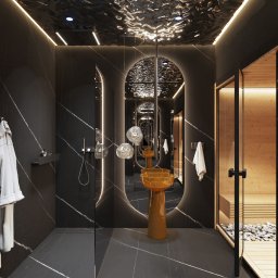 Archi-Kreatornia - Nowoczesna łazienka z czarnym marmurem, podświetlanym lustrem w kształcie portalu i sauną. Umywalka na postumencie w kolorze bursztynu. Minimalistyczny design.