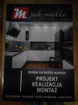 Czarno-biała ulotka reklamowa z wizualizacją białej kuchni z czarnymi blatami i napisem 'meble na każdy wymiar PROJEKT REALIZACJA MONTAŻ'.