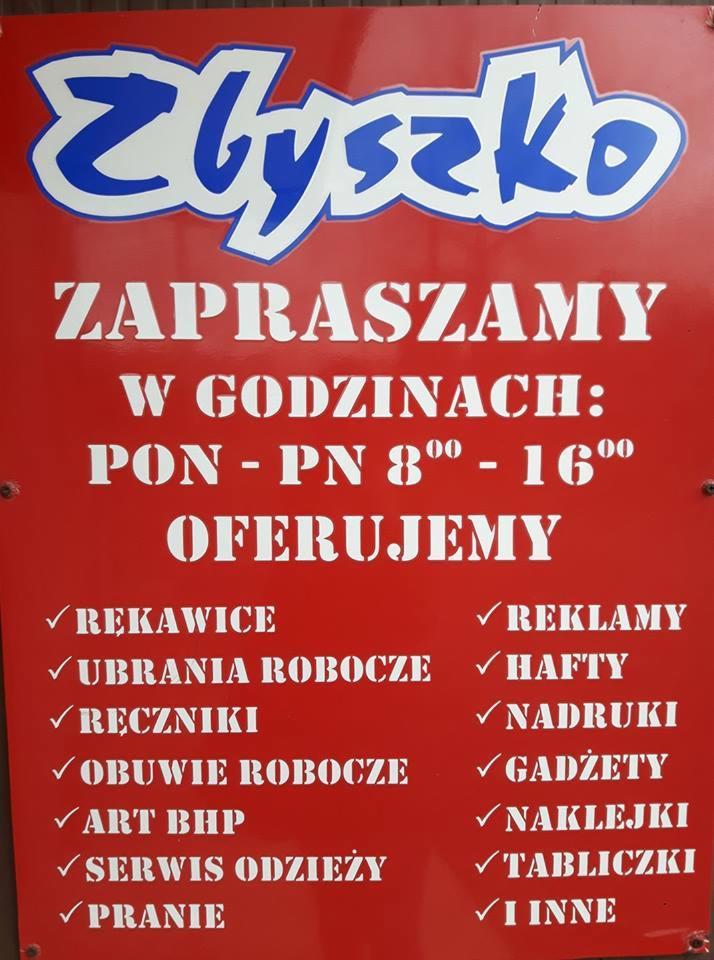 Szyld reklamowy firmy Zbyszko z ofertą: rękawice, ubrania i obuwie robocze, ręczniki, artykuły BHP, serwis odzieży, pranie, reklamy, hafty, nadruki, gadżety, naklejki, tabliczki i inne.