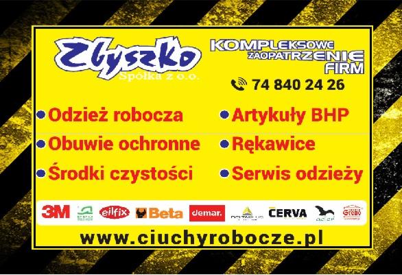 Żółto-czarny baner reklamowy firmy Zbyszko Spółka z o.o. oferującej kompleksowe zaopatrzenie firm w artykuły BHP, obuwie ochronne, rękawice, środki czystości i serwis odzieży, z numerem telefonu...