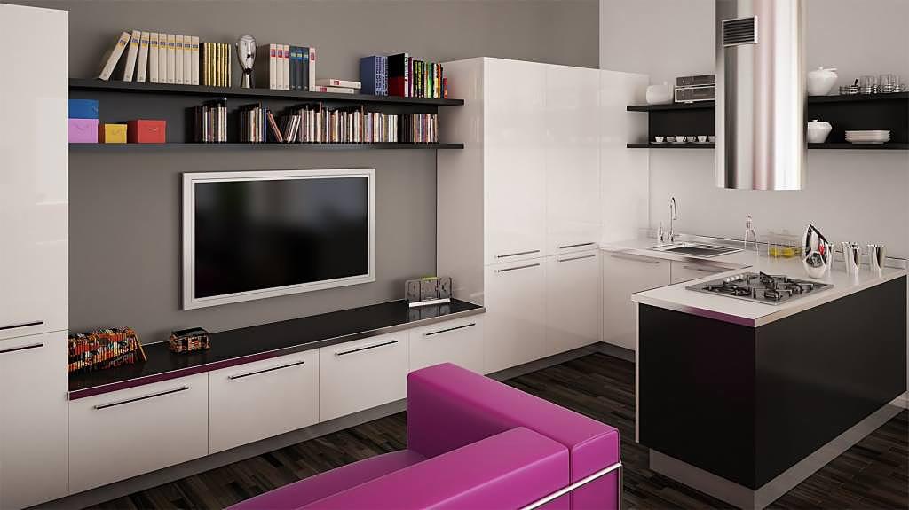 Nowoczesna kuchnia z białymi szafkami i czarnym blatem, wyspa kuchenna z płytą grzewczą, półki z książkami nad telewizorem, fioletowa sofa w tle.