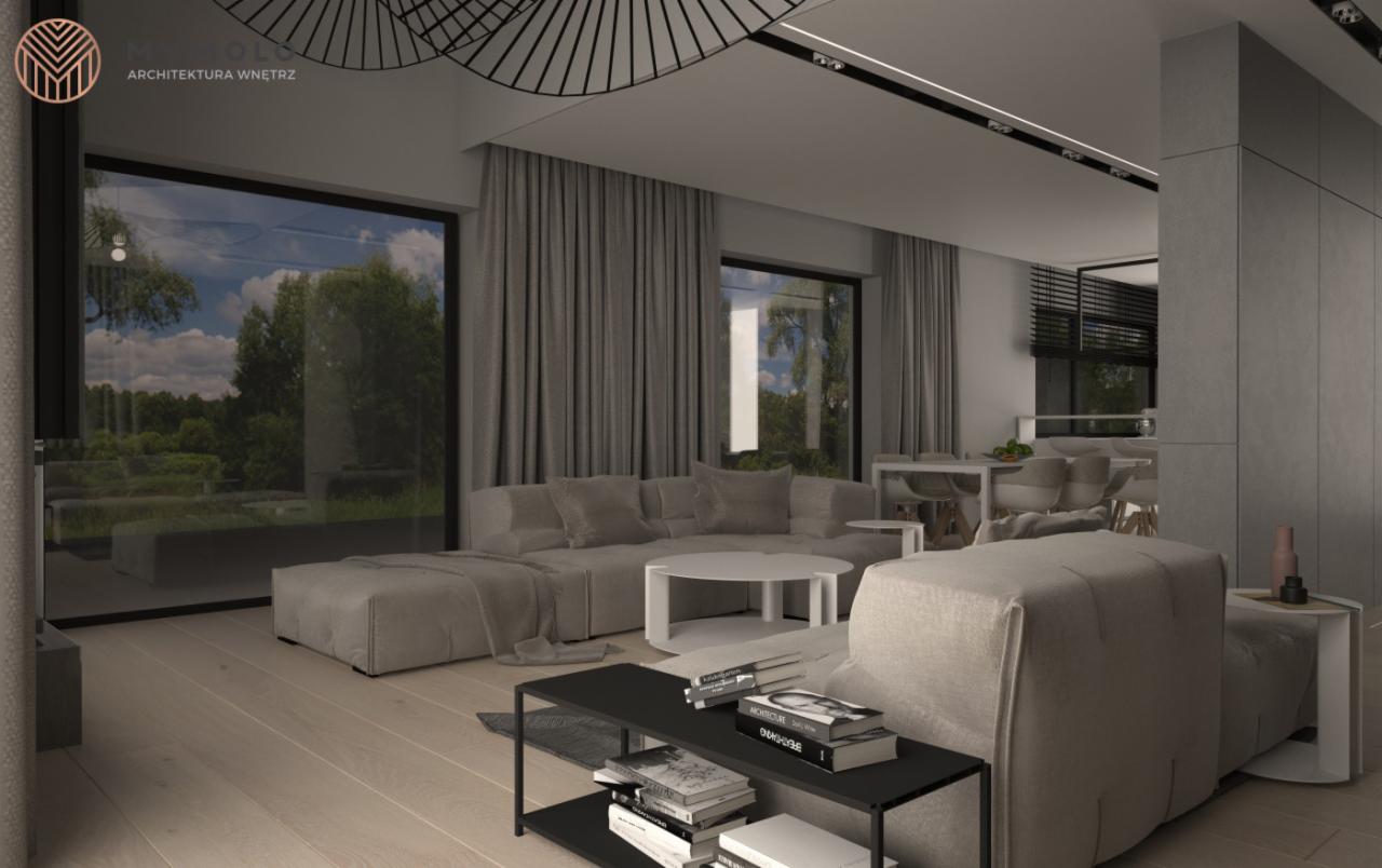 Wizualizacja salonu w odcieniach szarości z dużym narożnikiem, stolikiem kawowym i regałem na książki, widok na ogród przez panoramiczne okna, żyrandol o geometrycznym wzorze.