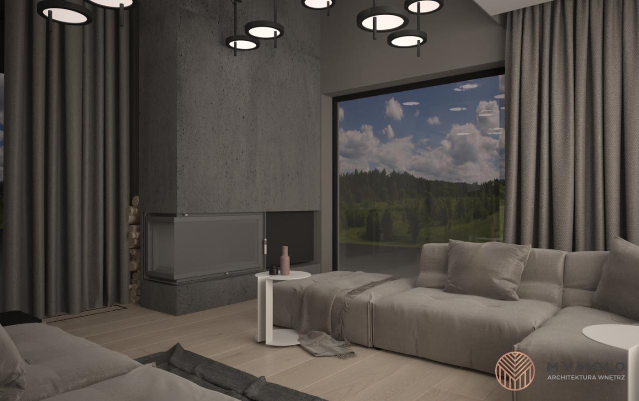 Wizualizacja salonu z szarą sofą modułową, kominkiem obłożonym betonem architektonicznym i widokiem na las przez duże okno. Minimalistyczne lampy sufitowe i zasłony w odcieniach szarości dopełniają...
