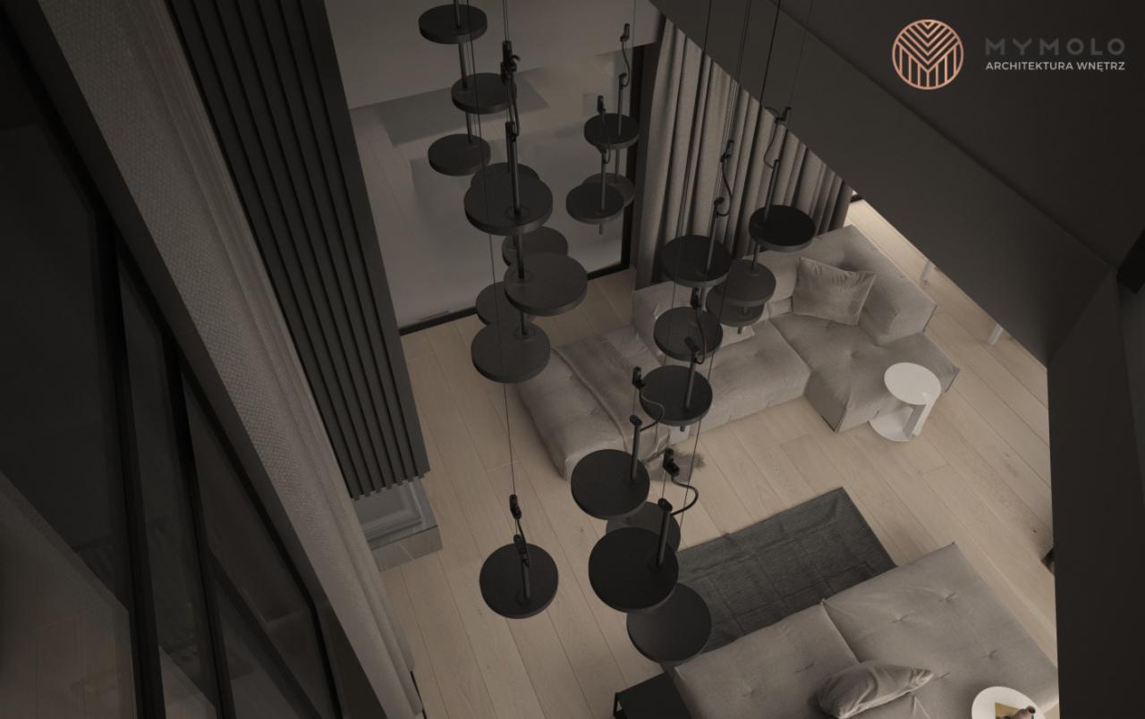 Nowoczesny salon z geometryczną sofą modułową w odcieniach szarości, drewnianą podłogą i oryginalną lampą wiszącą z okrągłymi elementami, widziany z góry.