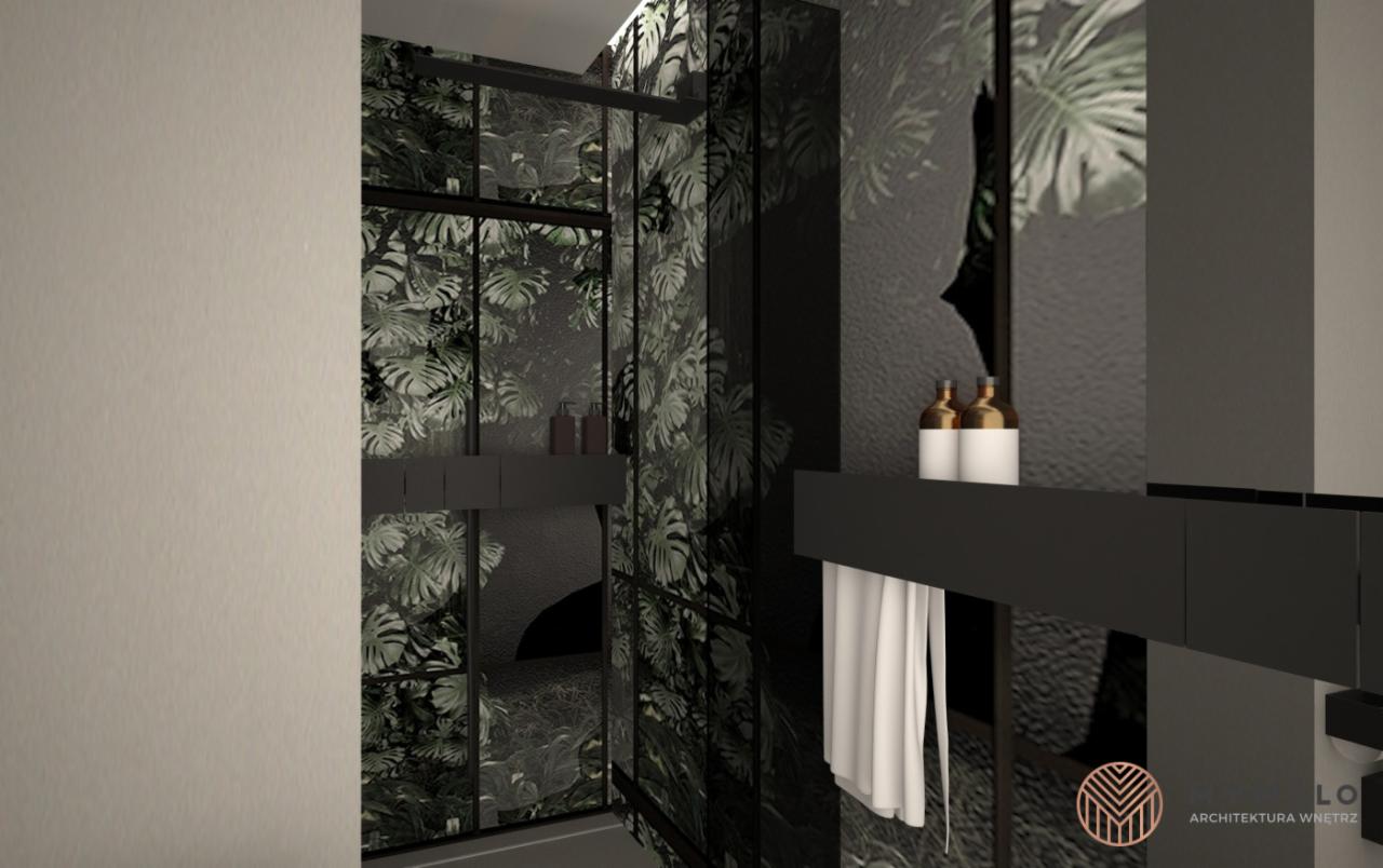 Wizualizacja łazienki z kabiną prysznicową typu walk-in, czarnymi ramami i motywem roślinnym na ścianach, uzupełniona o czarne półki i białe ręczniki, z widocznym logo architekta wnętrz.