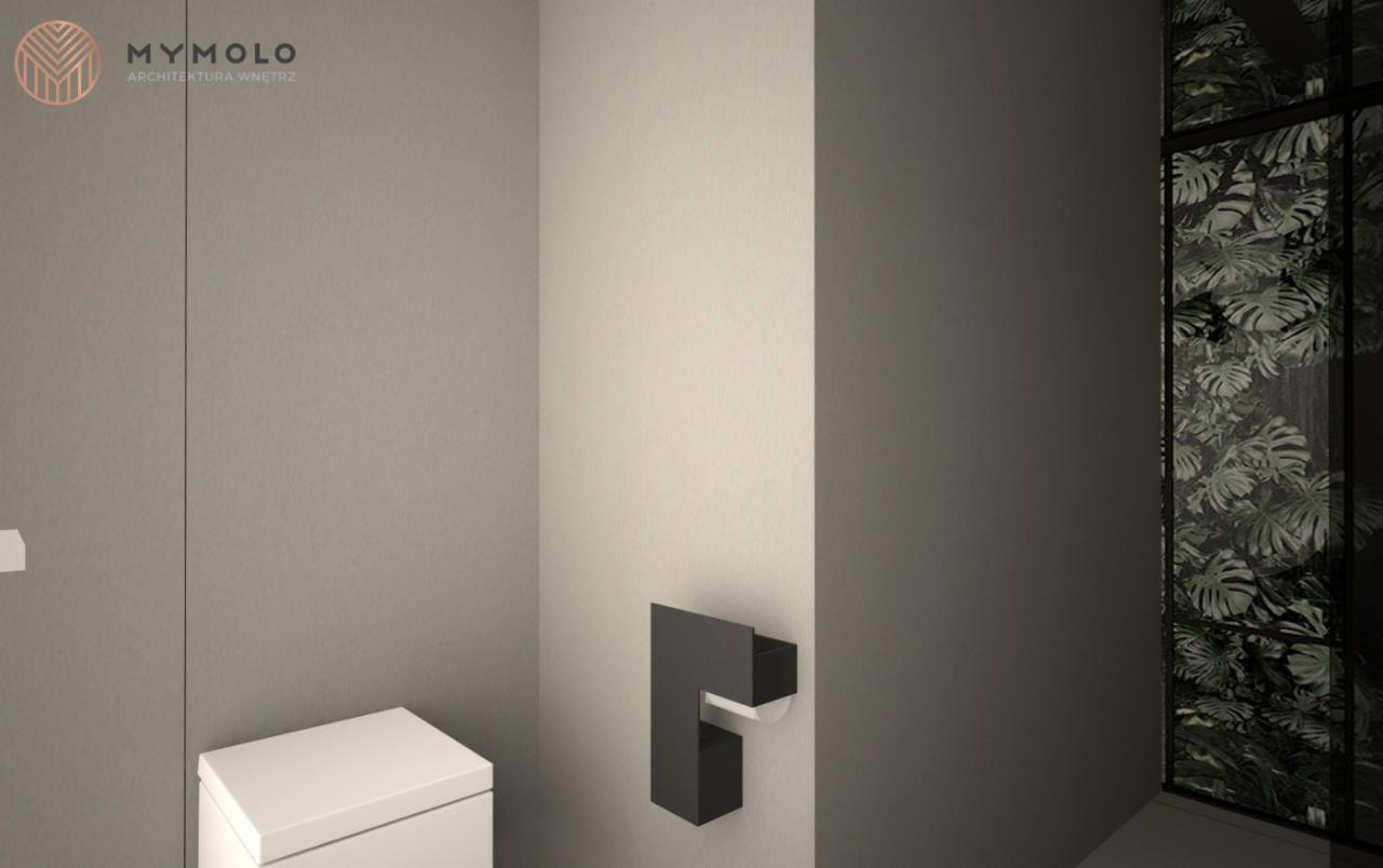 Minimalistyczna łazienka z toaletą, czarnym uchwytem na papier toaletowy i oknem z widokiem na bujną roślinność.