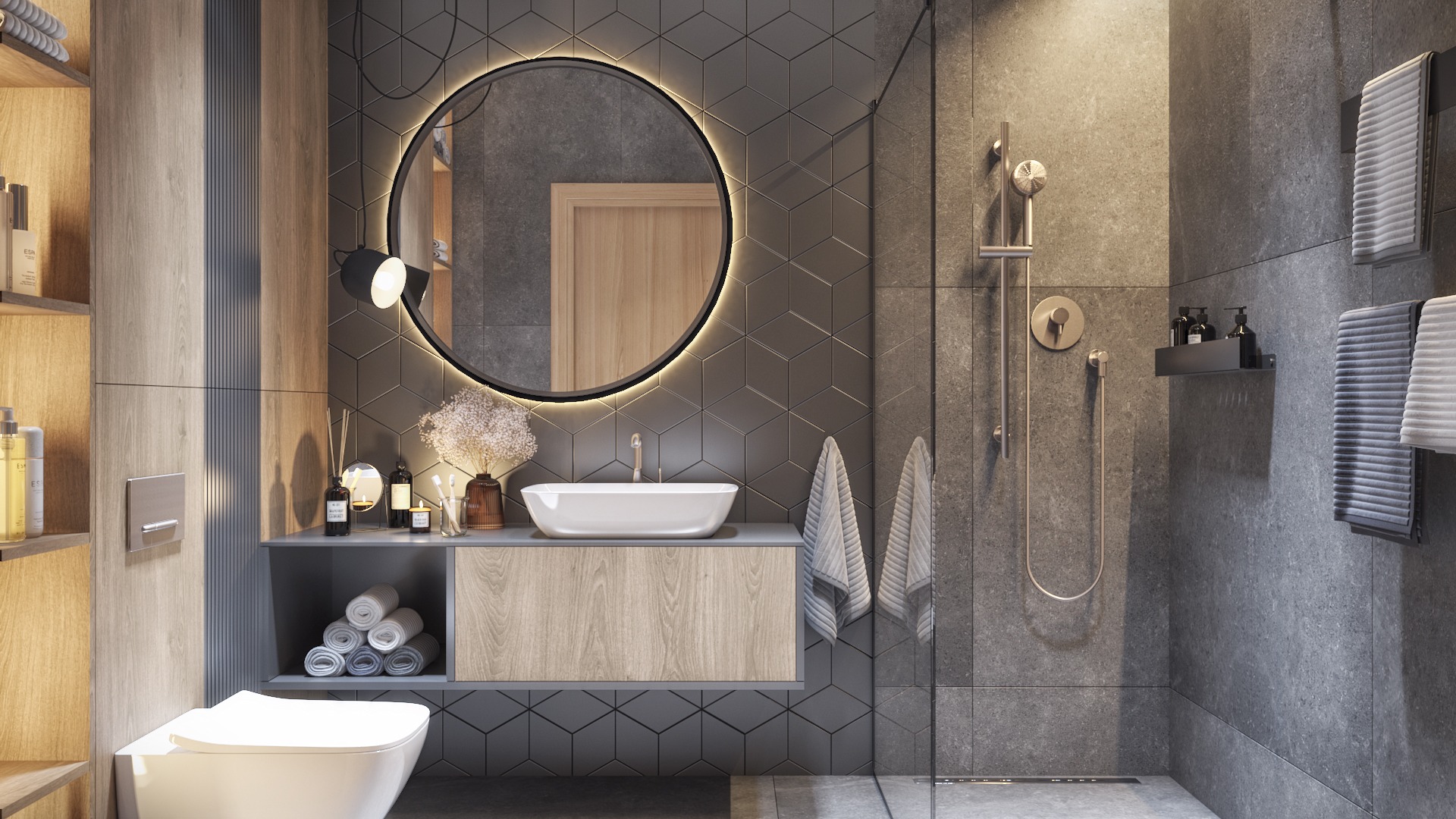 Nowoczesna łazienka z geometrycznymi szarymi płytkami, okrągłym lustrem z podświetleniem LED, wiszącą szafką z umywalką i kabiną prysznicową ze szklaną ścianką.