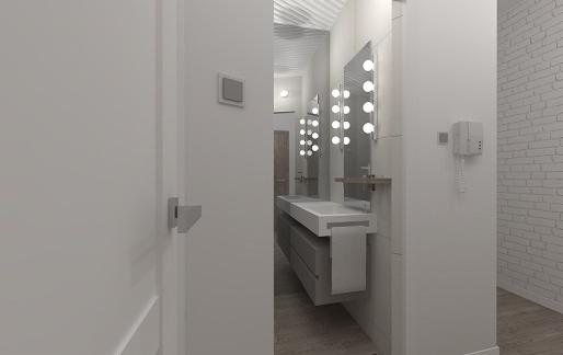 Nowoczesna łazienka z dwoma umywalkami, podświetlanymi lustrami z okrągłymi żarówkami, białą ceglaną ścianą i wiszącym telefonem.