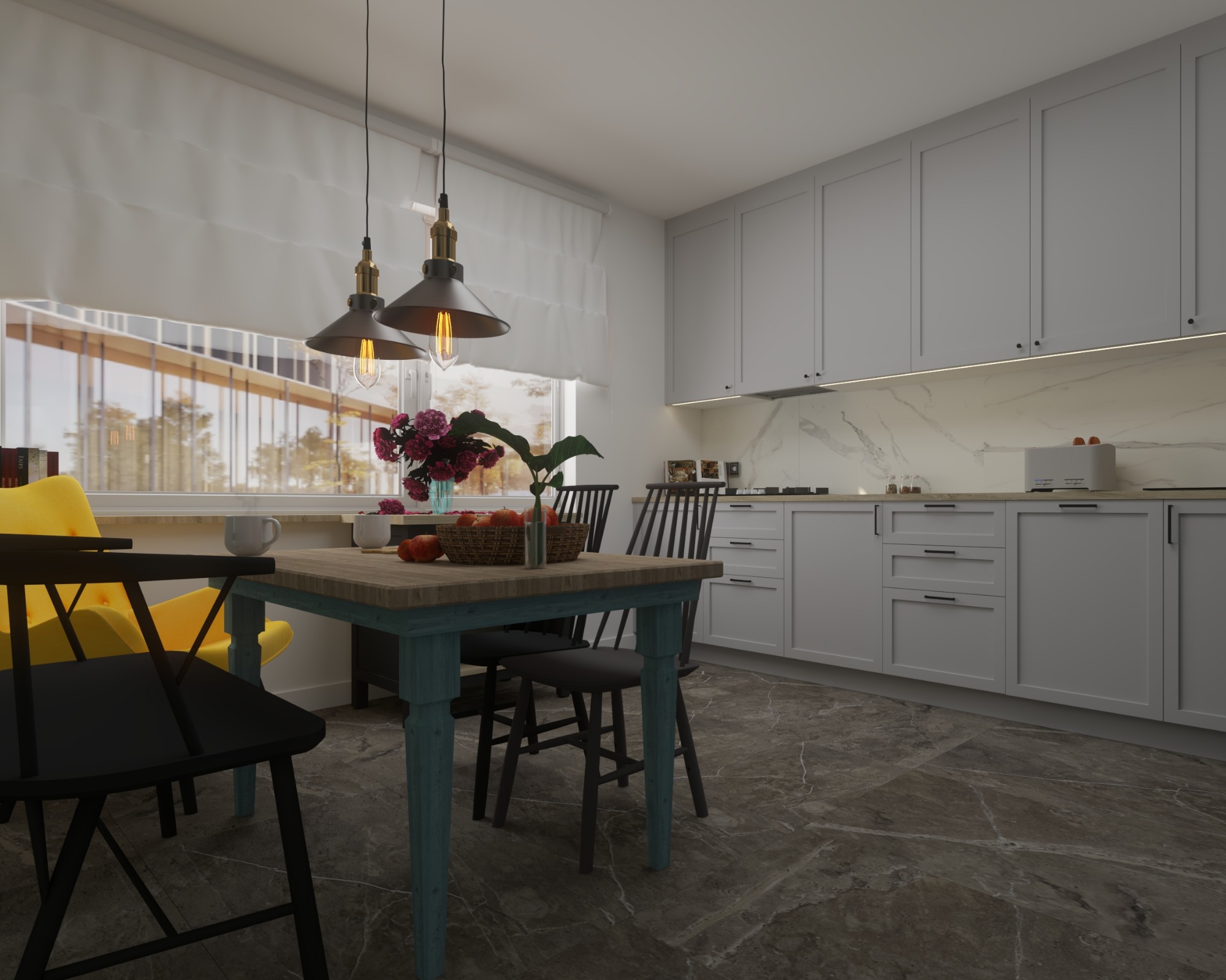 Jasna kuchnia z szarymi szafkami, drewnianym stołem z turkusowymi nogami, czarnymi krzesłami i marmurową podłogą; na stole wazon z kwiatami i koszyk z owocami, nad stołem wiszą lampy w stylu...