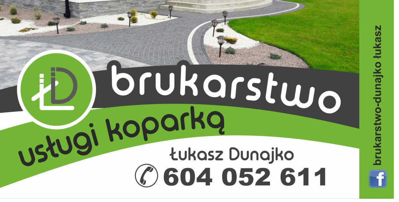 Zdjęcie wizytówki firmy brukarskiej z widoczną realizacją: ścieżka z jasnoszarej kostki brukowej z białymi obrzeżami i oświetleniem ogrodowym, otoczona trawnikiem i ozdobnym żwirem.