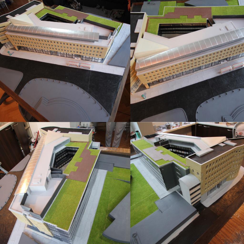 Makieta architektoniczna budynku biurowego z zielonym dachem i otoczeniem, prezentowana z różnych perspektyw na stole roboczym.