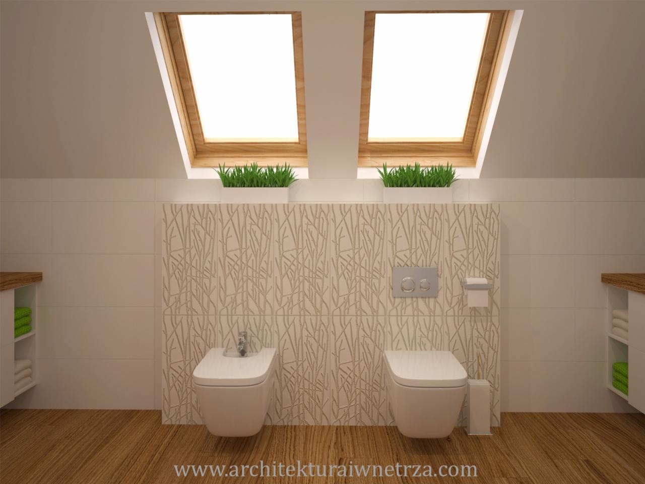 Jasna łazienka na poddaszu z drewnianą podłogą, białymi płytkami z motywem gałązek, bidetem i toaletą wiszącą oraz roślinami w doniczkach pod oknami dachowymi.