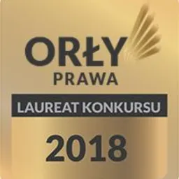 Złota odznaka 'Orły Prawa' z napisem 'Laureat Konkursu 2018' i symbolem piór