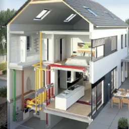 Przekrój domu jednorodzinnego prezentujący system dystrybucji powietrza Zhender OnFloor z widocznymi rurami w kolorach żółtym, czerwonym i zielonym, prowadzącymi przez poszczególne pomieszczenia.