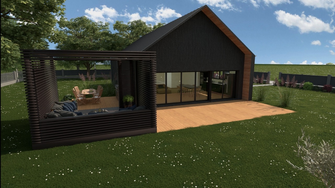 Wizualizacja nowoczesnego domu z czarną elewacją i drewnianym tarasem, połączonego z ażurową pergolą z meblami wypoczynkowymi, otoczonego zielonym trawnikiem z drobnymi kwiatami.