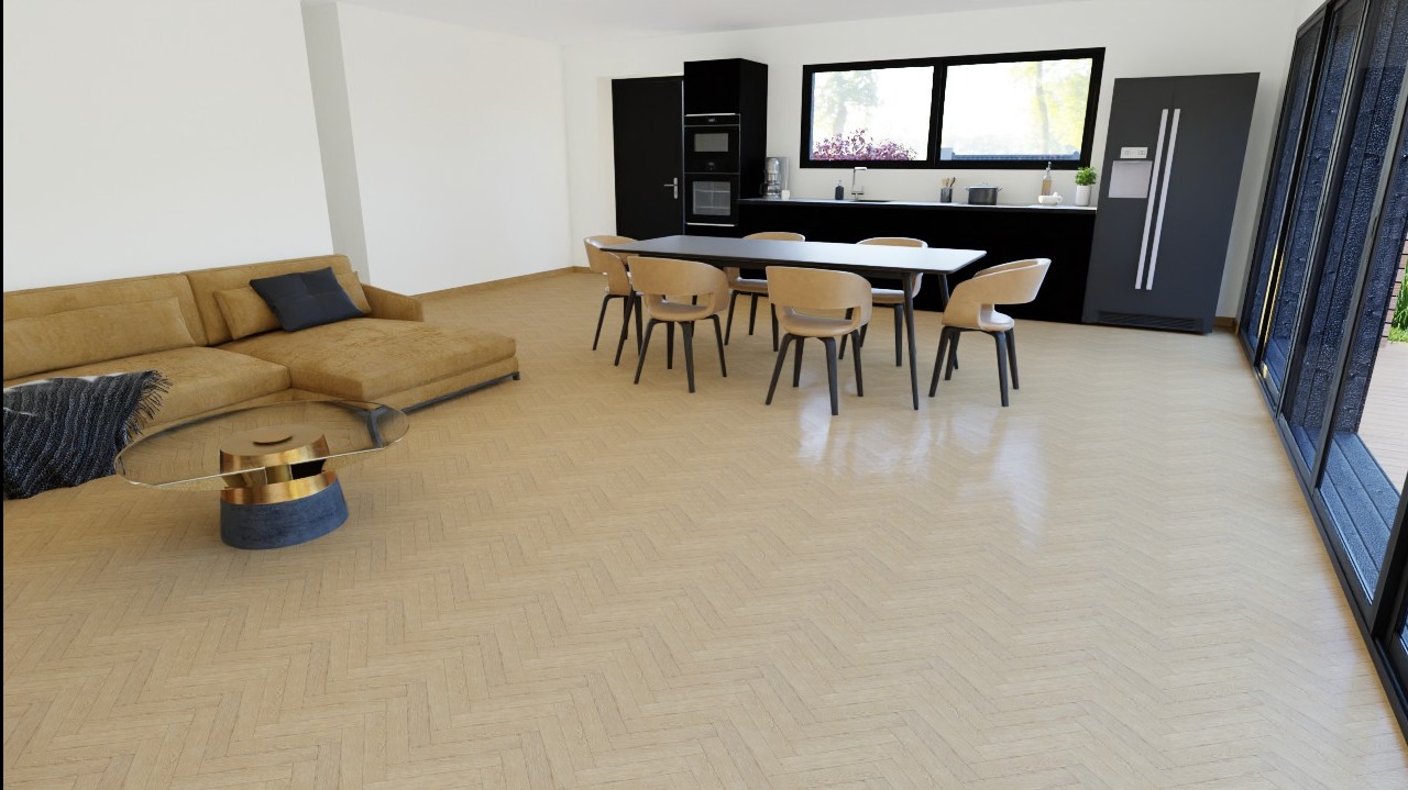 Jasny salon z parkietem w jodełkę, beżową sofą z granatową poduszką, okrągłym stolikiem kawowym z elementami złota i granatu, stołem jadalnym z krzesłami, czarną zabudową kuchenną i dużym oknem...