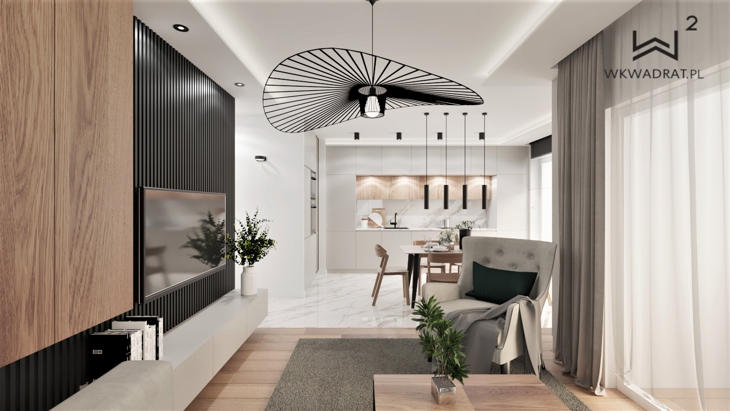 Wnętrze mieszkania w nowoczesnym stylu: salon z aneksem kuchennym, designerska lampa wisząca, drewniana ściana z telewizorem, szary dywan i fotel z poduszką. Widoczny fragment logo firmy WKwadrat.pl.