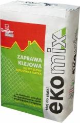 Worek zaprawy klejowej Torggler Ekomix do warstwy zbrojonej siatką, widoczne logo producenta, zielono-czerwona kolorystyka opakowania.