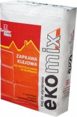 Worek z zaprawą klejową do styropianu marki Torgler, etykieta w odcieniach czerwieni i pomarańczy, widoczny napis 'ekoMix', waga 25 kg.