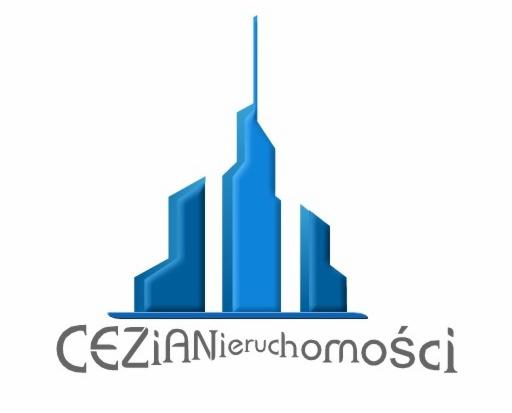 Logo firmy CEZIANieruchomości przedstawiające stylizowany, błękitny budynek na białym tle.