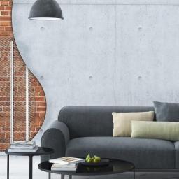 ELEMIX - Wizualizacja ściany z odsłoniętą cegłą i kratką wentylacyjną w nowoczesnym salonie z szarą sofą i betonową ścianą.