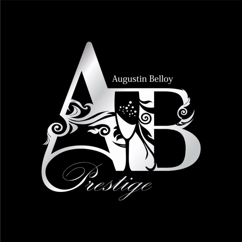 Eleganckie logo w srebrnej kolorystyce na czarnym tle, przedstawiające inicjały 'AB' z elementami dekoracyjnymi i napisem 'Prestige' w ozdobnej czcionce.
