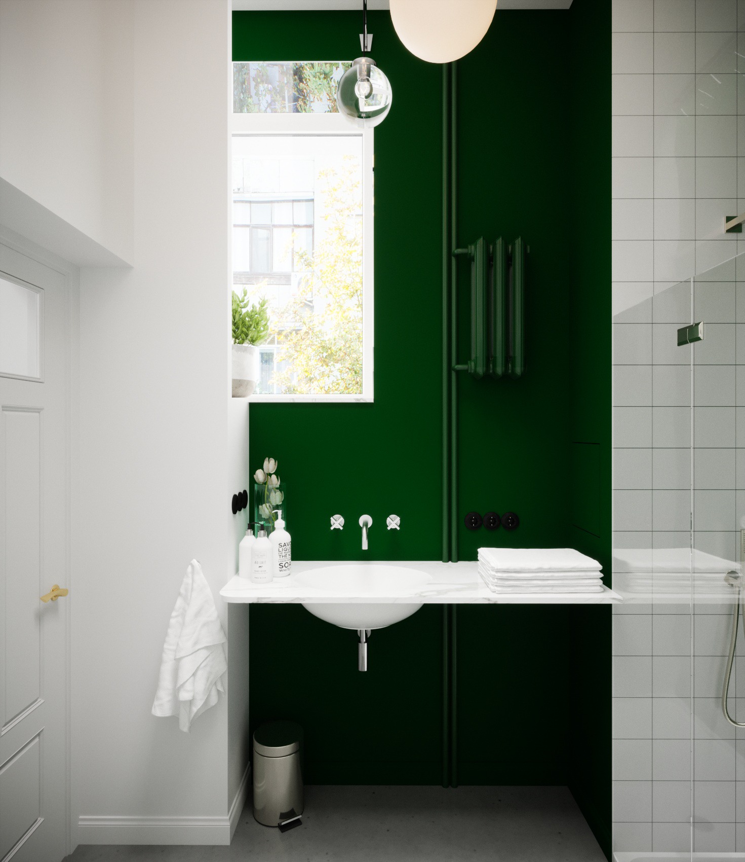 Nowoczesna łazienka z głęboką zielenią ścian, białą umywalką nablatową, chromowaną armaturą i grzejnikiem w kolorze ściany, oświetlona naturalnym światłem z okna z widokiem na drzewa.