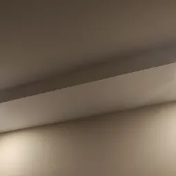 Fragment sufitu z zamontowanymi dwoma punktowymi lampami LED, oświetlającymi jasną ścianę.