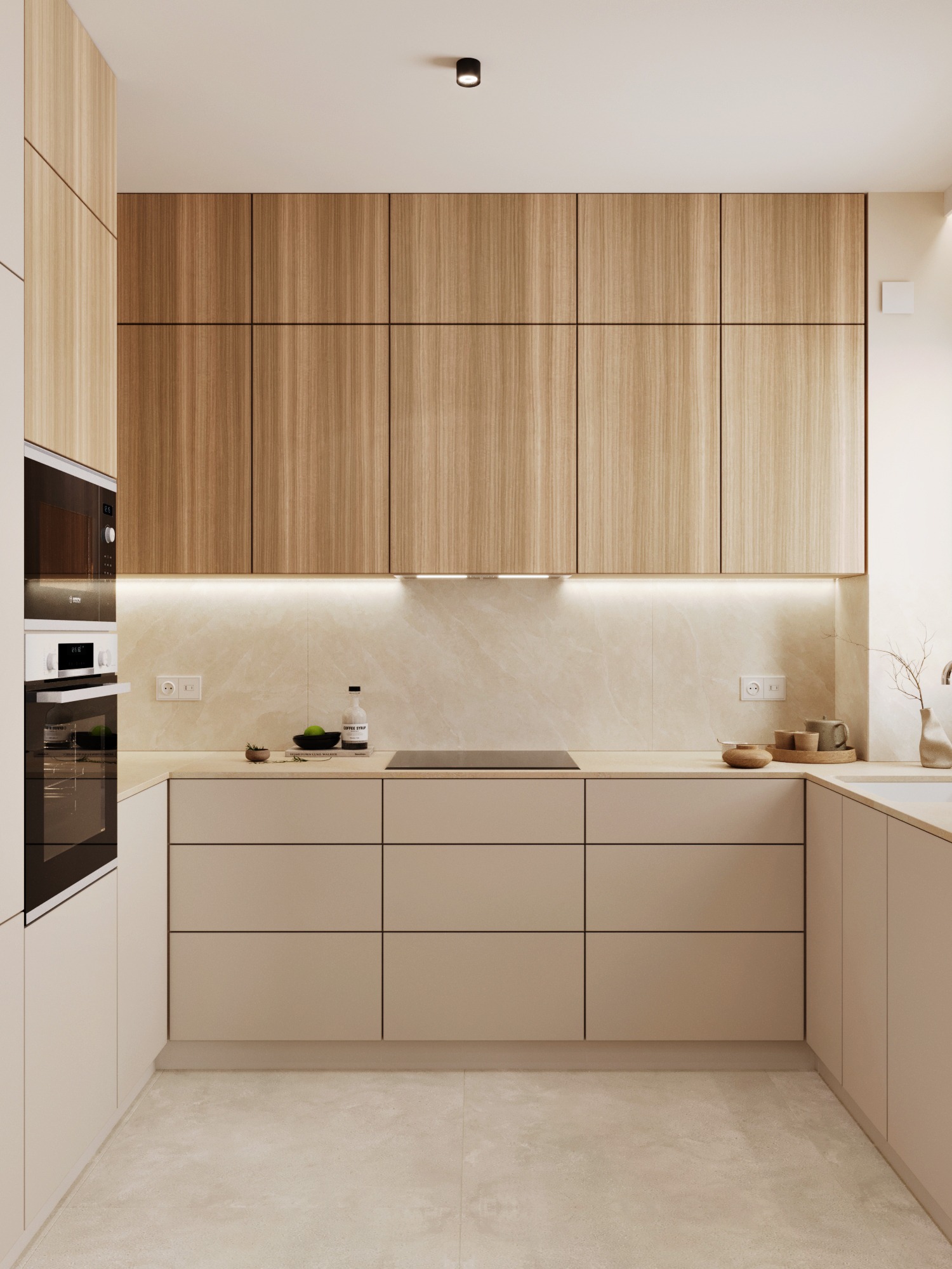 Minimalistyczna kuchnia w beżach i drewnie: zabudowa meblowa, sprzęt AGD w zabudowie, oświetlenie LED podszafkowe, kamienny blat i podłoga. Nowoczesny design.