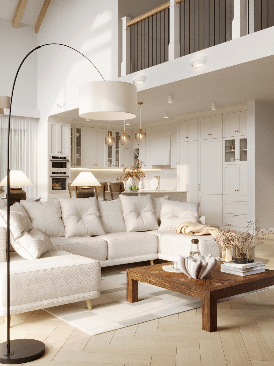 Jasne wnętrze: narożnik z poduchami, drewniany stolik kawowy z dekoracjami, w tle biała zabudowa kuchenna i antresola z balustradą. Minimalistyczny design.