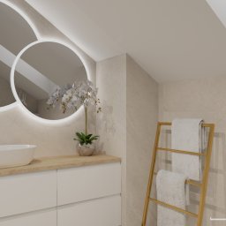 JLStudio Projekt - Jasna łazienka na poddaszu w Krakowie z okrągłymi lustrami podświetlonymi LED, białą umywalką nablatową, złotą armaturą, drewnianym blatem, grzejnikiem drabinkowym i beżowymi płytkami.