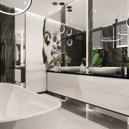 archdesign Agnieszka Romańczyk - Nowoczesna łazienka z wanną wolnostojącą, czarno-białymi marmurowymi ścianami, podwójną umywalką i roślinami. Oświetlenie LED podkreśla minimalistyczny design.