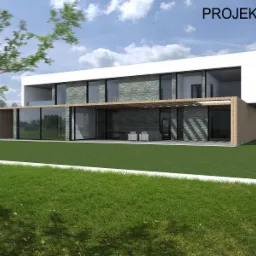 Wizualizacja nowoczesnego, dwukondygnacyjnego domu z płaskim dachem, wykończonego kamieniem i drewnem, z dużymi przeszkleniami i tarasem z pergolą, otoczonego zielonym trawnikiem i drzewami.