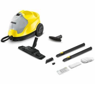 Żółto-szary parowy czyszczący Kärcher z różnymi końcówkami i akcesoriami na białym tle, widok z góry pod kątem.