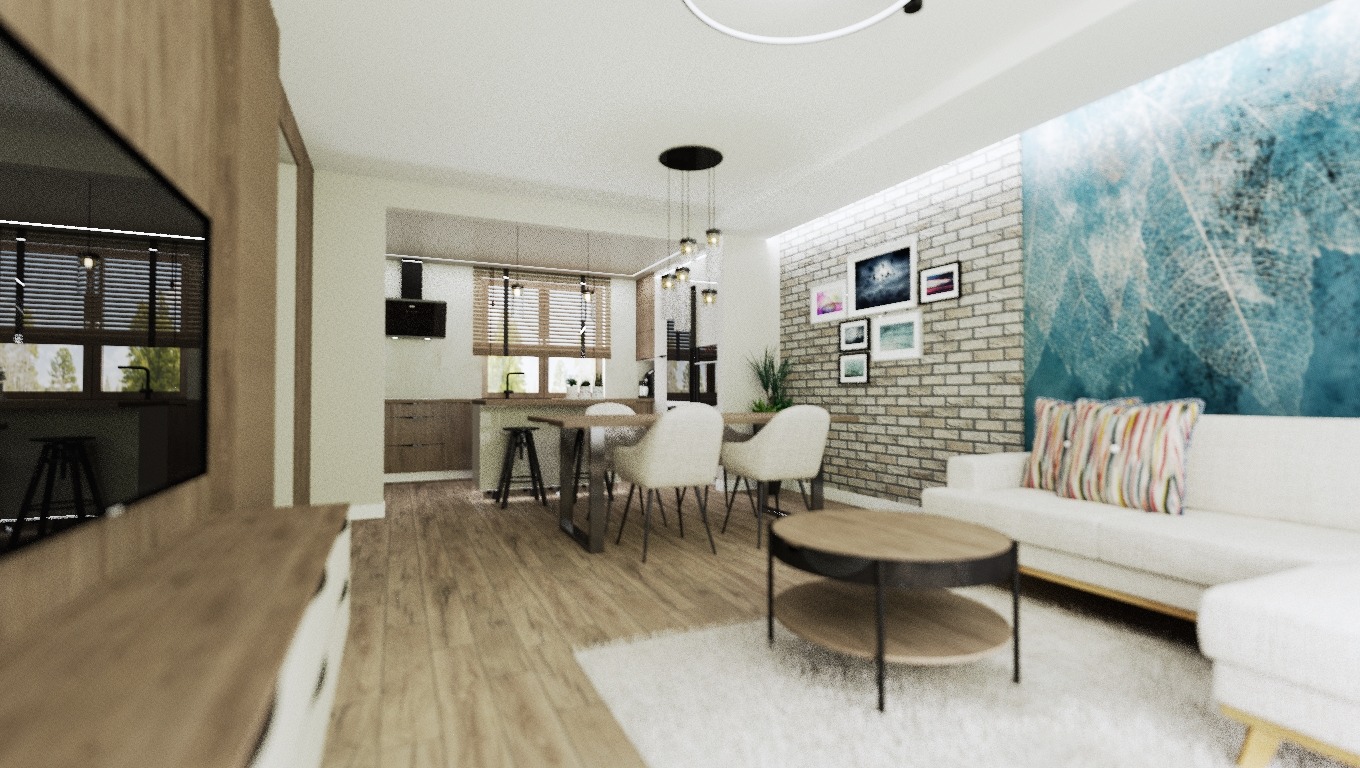 Jasne, przestronne wnętrze mieszkania z otwartą kuchnią, jadalnią i salonem. Widoczny drewniany stół z krzesłami, biała sofa z kolorowymi poduszkami na tle ściany z cegły i abstrakcyjnym malowidłem...