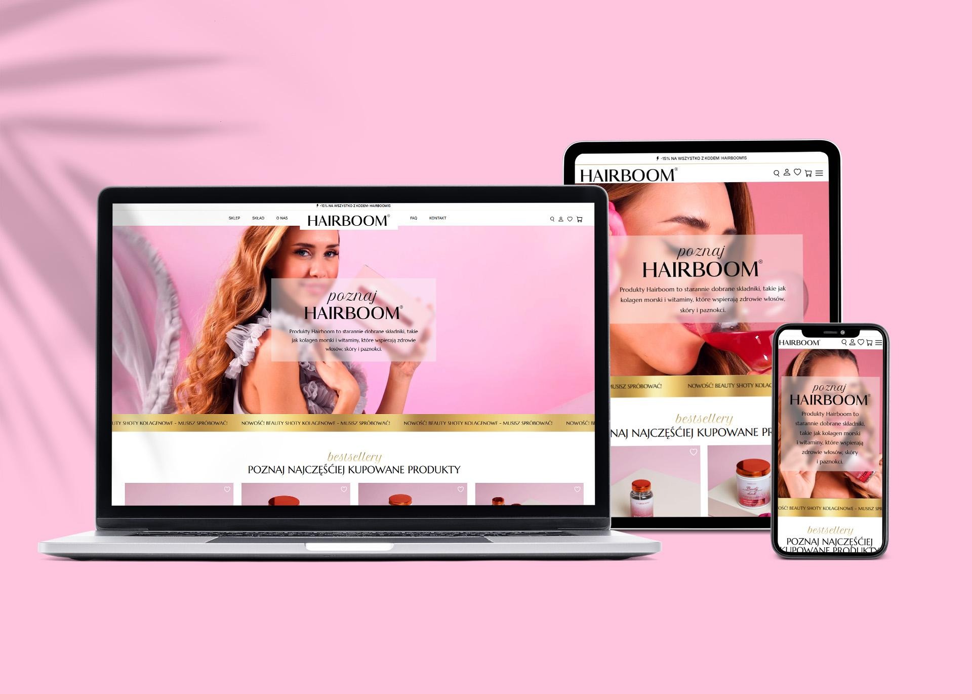 Responsywna strona Hairboom na laptopie, tablecie i smartfonie. Widok strony głównej z produktami do pielęgnacji włosów, skóry i paznokci. Różowe tło.
