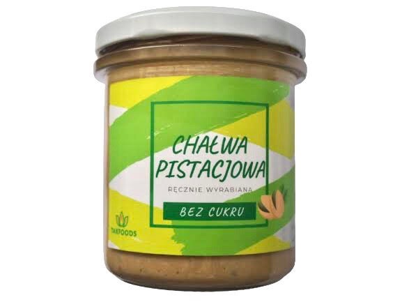 Słoik chałwy pistacjowej bez cukru, ręcznie wyrabianej, z zielono-białym tłem etykiety i pistacjami na etykiecie.