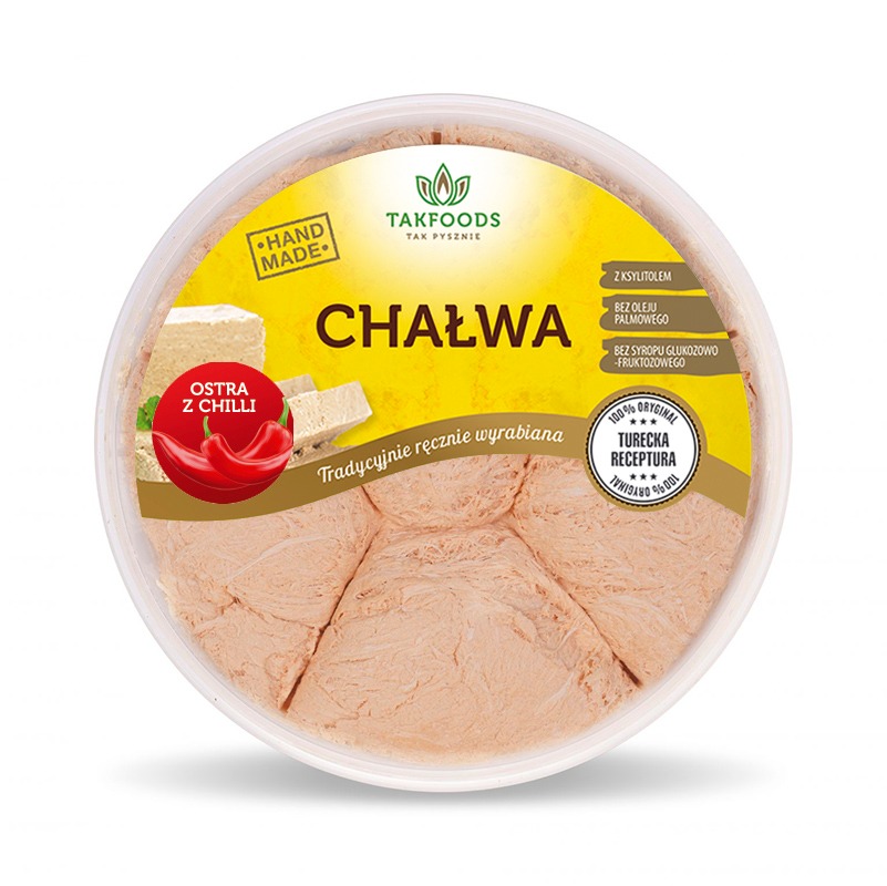 Okrągłe opakowanie chałwy z chili marki Takfoods, z informacją o ręcznym wyrobie i braku oleju palmowego oraz syropu glukozowo-fruktozowego, z oznaczeniem '100% oryginalna turecka receptura'.