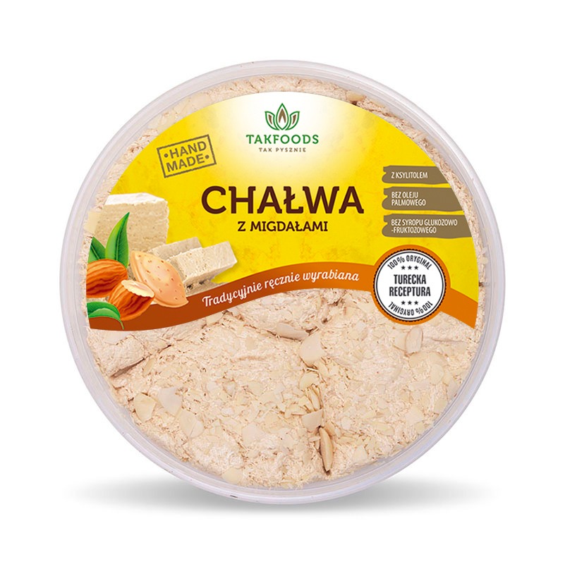 Okrągłe opakowanie chałwy z migdałami marki Takfoods, z informacją o ręcznym wyrobie i braku oleju palmowego oraz syropu glukozowo-fruktozowego, na białym tle.