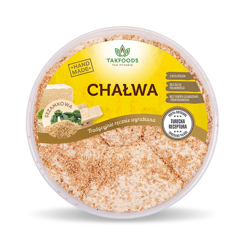 Okrągłe opakowanie chałwy sezamowej Takfoods z etykietą informującą o ręcznym wykonaniu i braku oleju palmowego, syropu glukozowo-fruktozowego oraz dodatku ksylitolu, prezentujące tradycyjną...