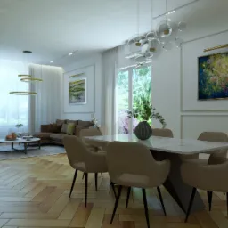 Jasne wnętrze rezydencji w Zabierzowie z parkietem w jodełkę, stołem z marmurowym blatem i beżowymi krzesłami. W tle widoczny salon z brązową sofą i obrazami na ścianach.