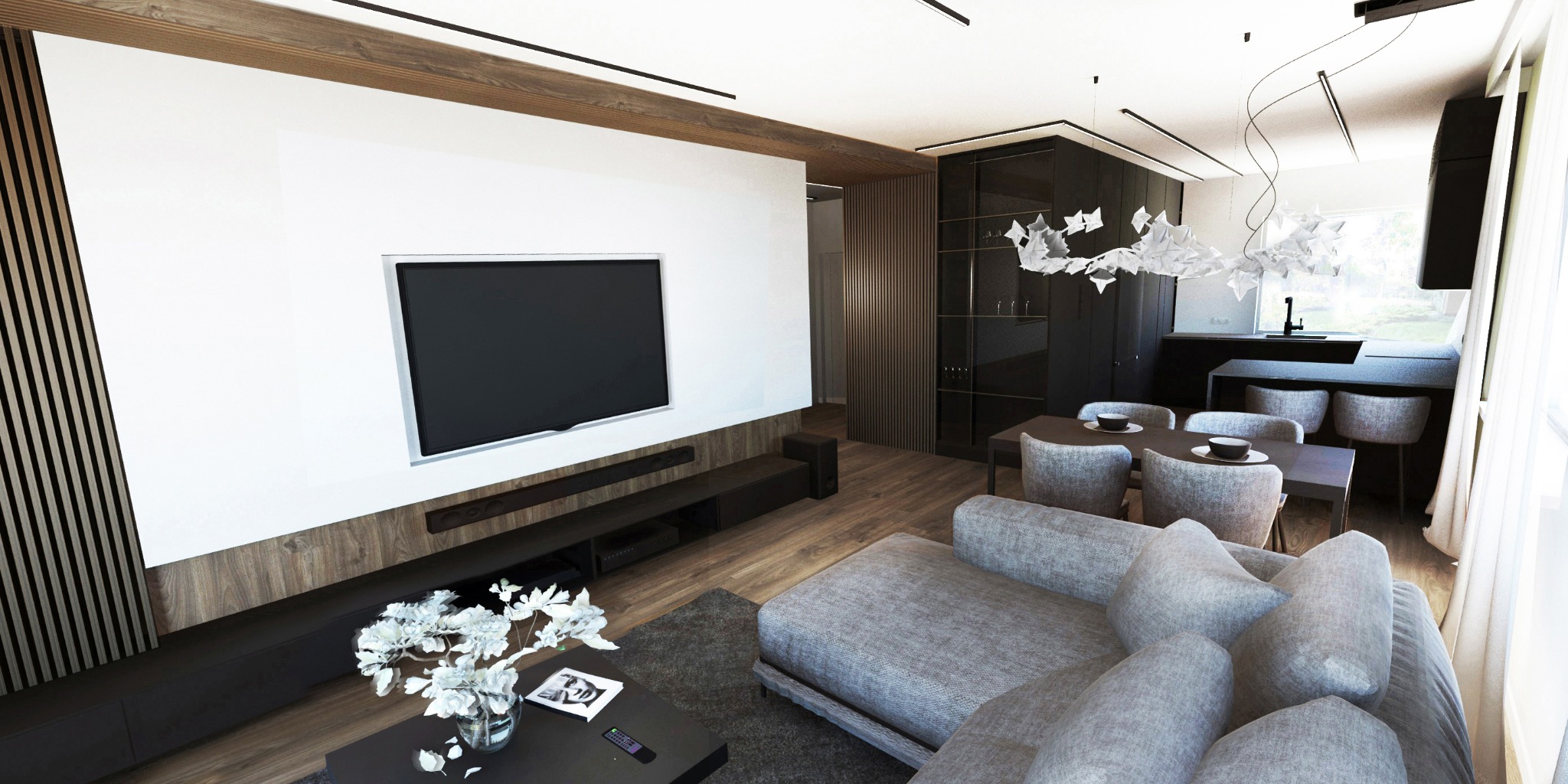 Wnętrze salonu z jadalnią w nowoczesnym stylu, szara sofa narożna, stół z krzesłami, zabudowa RTV z telewizorem, dekoracyjna lampa nad stołem, drewniane akcenty na ścianach.